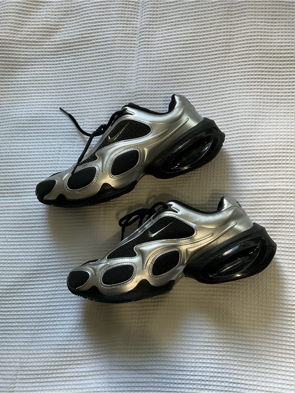 Nike Air Max Muse sneakers in a metallic silver and black colourway